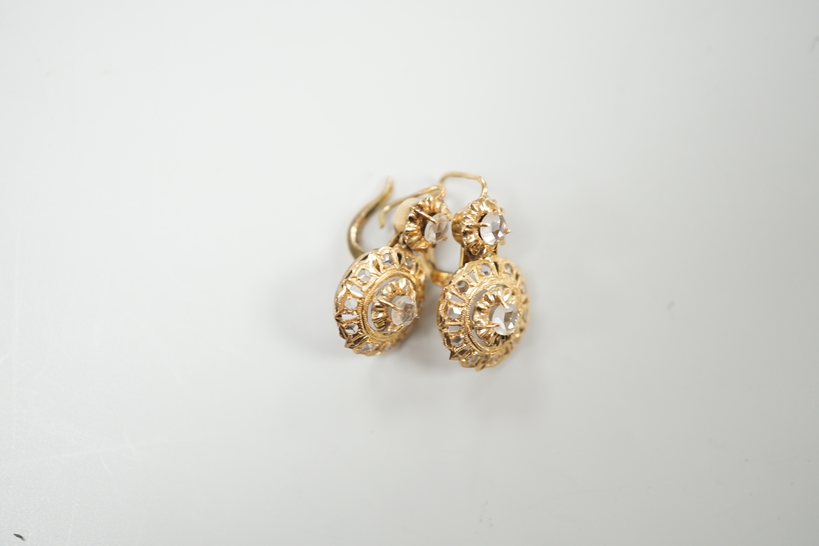 A pair of yellow metal and simulated rose cut diamond cluster set drop earrings, overall 21mm, gross weight 3 grams.